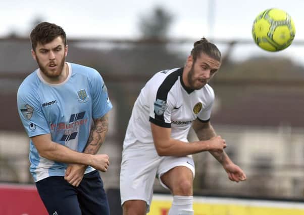 Ballymena's Cathair Friel 
and Carrick's Stephen McCullough
during Saturday's match