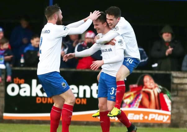 Linfield's Niall Quinn celebrates after scoring to make it 3-0.
