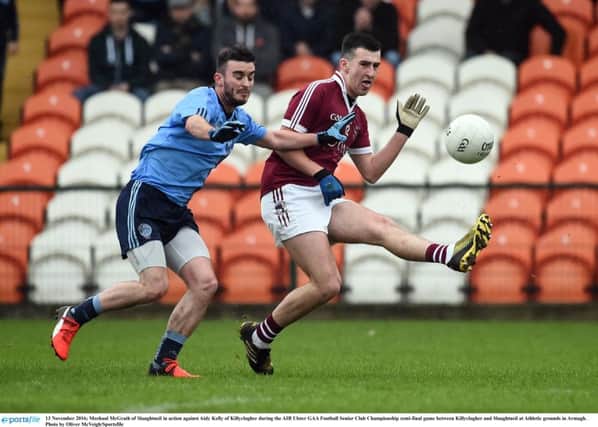 Slaughtneil goalscorer Meehaul McGrath in action against Aidy Kelly of Killyclogher during the AIB Ulster GAA Football Senior Club Championship semi-final at Athletic grounds in Armagh. (Photo by Oliver McVeigh/Sportsfile)