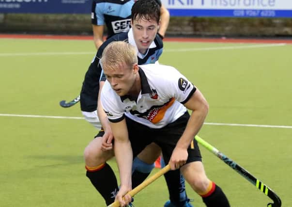 Lisnagarvey's  Sean Murray and Banbridge's Peter Brown in action on Sunday. Pic: Presseye.
