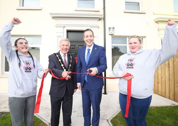 Shannon McNally and Hayley Millar, young people from MACS NI, join the Mayor of Lisburn and Castlereagh City Council, Cllr Brian Bloomfield MBE and the Minister for Communities, Paul Givan MLA to celebrate the official opening of MACS NI and Fold Housing Associations new housing scheme for young people.
