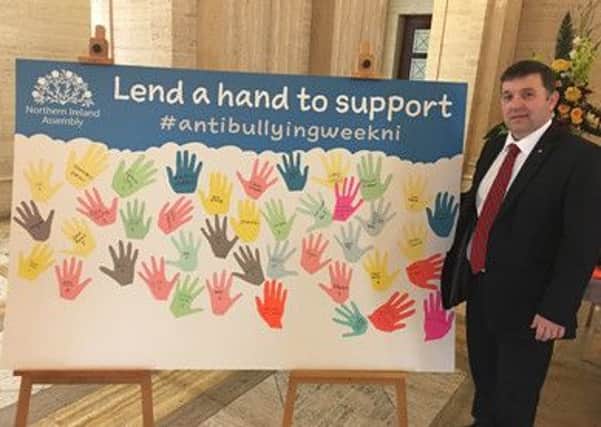 Robin Swann congratulates supporters of Anti-Bullying campaign.