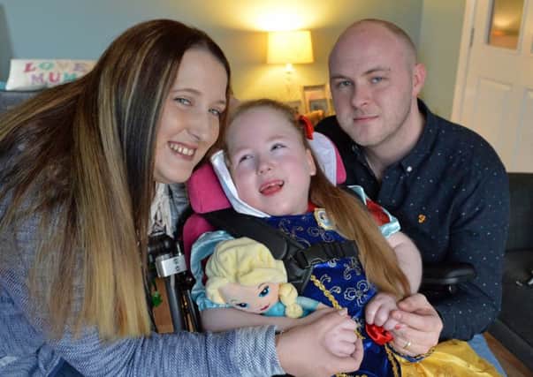 Little Mix fan, Cora McQuade-Denvir with mum, Amy and dad, Ciaran. INLT 10-006-PSB