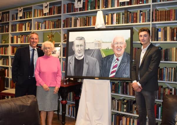 Patrick presenting his painting to Baroness Paisley and Ian Paisley Jnr. INNT 47-822CON