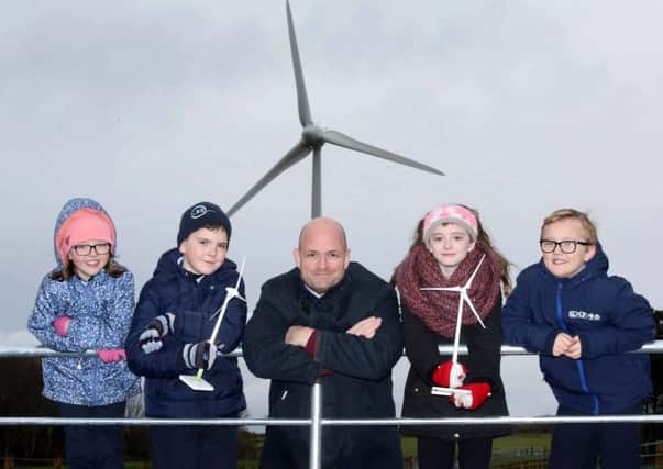 Patrick McClughan, Head of Corporate Affairs for Gaelectric Developments Ltd with Corina Davidson, Angus Graham, Abbie Alexander and Joel McMullan from Straidbilly PS at the Cloonty Wind Farm between Derrykeighan and Bushmills . Picture Darren Kidd (Press Eye)