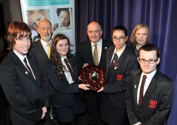 Ballymena Academy pupils Jackson Barr, Lucy Bill, Leah Anderson,l and Caleb Dempsey who were the winners of the 1stWomen's Aid Inaugural Debate in the Braid are seen with David Ford, PSNI Detective Chief Superintendant George Claeke and Women' Aid Carol Fordyce.(Submitted)