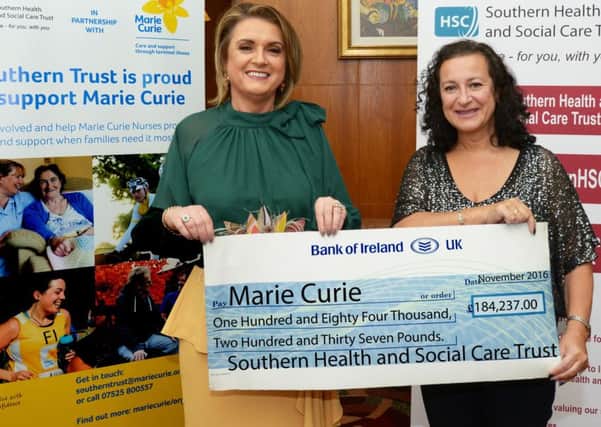 Mrs Roberta Brownlee Southern Trust Chair (left) presents Jude Bridge, Marie Curie Executive Director