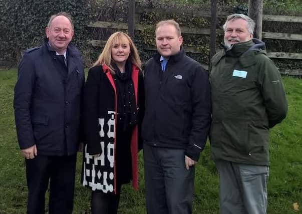 William Irwin MLA, Minister Michelle McIlveen, Cllr. Gareth Wilson and Forest Service Chief Executive Malcolm Beatty at the main entrance to Gosford Forest Park.  INPT47