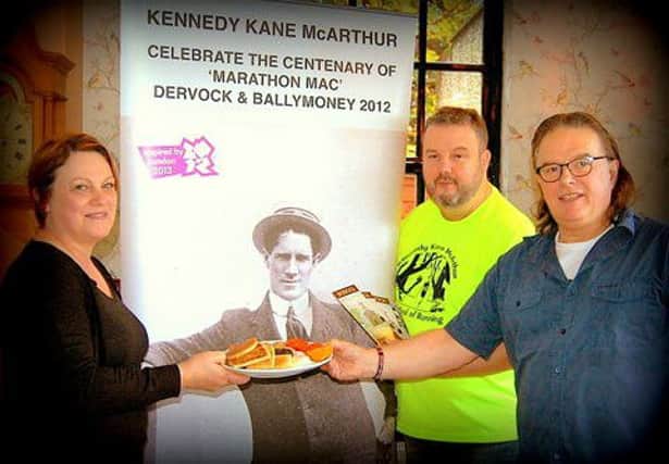 Mrs Jennifer Laverty with Big Ken's Breakfast Frankie Cunningham with pamphlets (local history) and Dave Kane (Dervock Community Association).