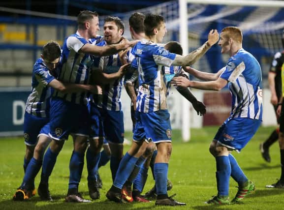 Coleraine, pictured celebrating their extra-time win over Crusaders in the 

Northern Ireland League Cup quarter-finals, will meet rivals, Ballymena in the last four.
