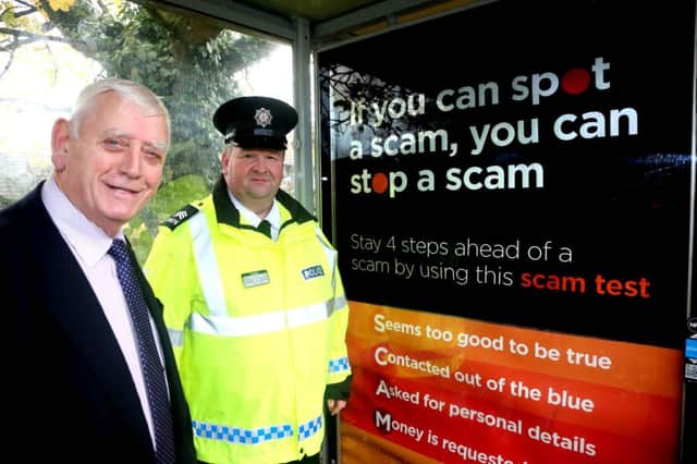 Alderman William King, PCSP chair  and Community Safety Sergeant Terry McKenna at one of the advertising sites across Causeway Coast and Glens for the ScamwiseNI campaign. INCR 48-708-CON