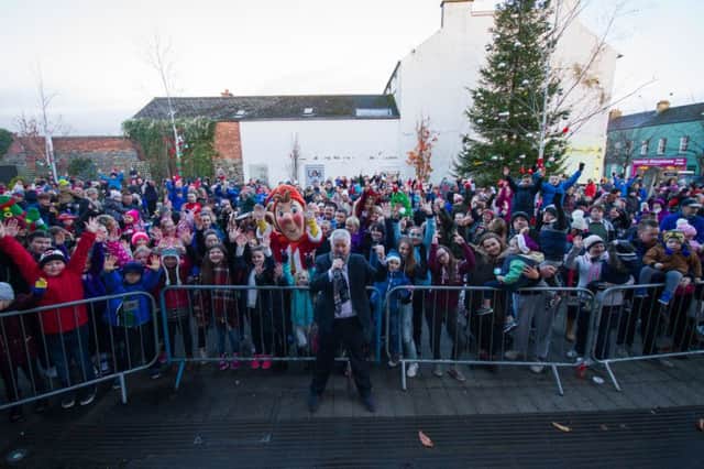 Compere Brian Moore entertains the waiting crowd in Limavady ahead of the switching on of the Christmas lights. INLS 48-704-CON