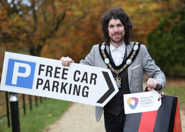 Lord Mayor of Armagh City, Banbridge and Craigavon Borough, Councillor Garath Keating, drives home the message of free Saturday parking in the borough to festive shoppers.