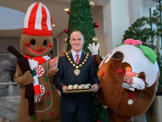 The Chair of Mid Ulster District Council, Councillor Trevor Wilson, pictured at Meadowlane Shopping Centre with some festive friends launching the Magherafelt Christmas Market which takes place from 2nd  4th December.