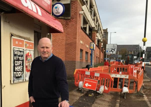 Ballymena businessman Eugene Diamond slams electricity chiefs after his shop is surrounded by diggers and workmen without warning. INBT 48 EUGENE