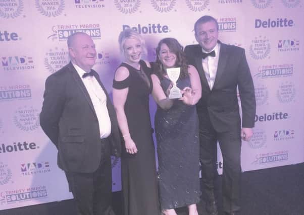 The Giants Causeway team collect their award for the UKs Best Heritage Attraction at the 2016 British Travel Awards