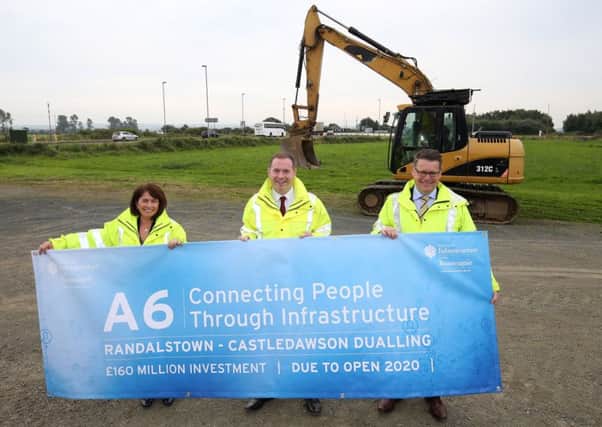 A picture issued this August of Deirdre Mackle, divisional roads manager, infrastructure minister Chris Hazzard, and Andrew Hitchenor, strategic road improvements manager as the minister announced Â£160m will be invested in the A6 Randalstown-to-Castledawson dualling scheme
