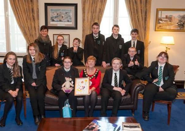 Mid and East Antrim Borough, Councillor Audrey Wales MBE thanked all the pupils who attended from Castle Tower and who enjoyed tea in the Mayors Parlour. Also pictured is art teacher, Marie OConnor