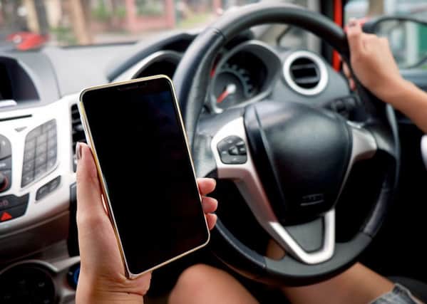 Using a mobile device while driving is illegal.