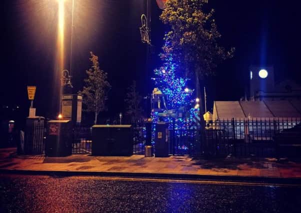 Staff erecting lights on Ballyclare Christmas tree in the early hours of Friday morning. Pic by Love Ballyclare. INNT 48-819CON