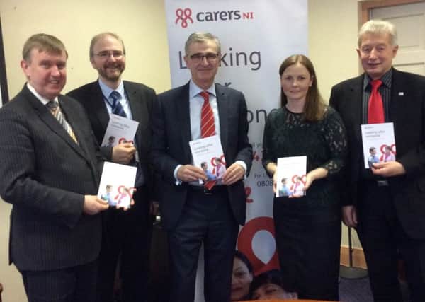 Mervyn Storey  with Brian Peticrew Heath Board, Dr Tony Stevens Northern Trust Clair Anne Magee Carers Ni and Kevin Daly