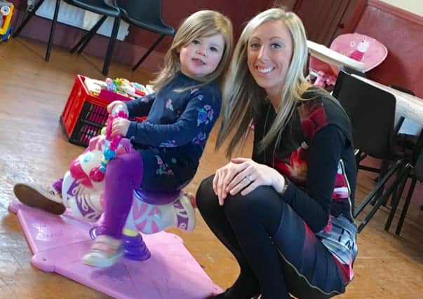 Carla Lockhart MLA with Hope Murphy at Jellybeans mother and toddler group in Blackskull.