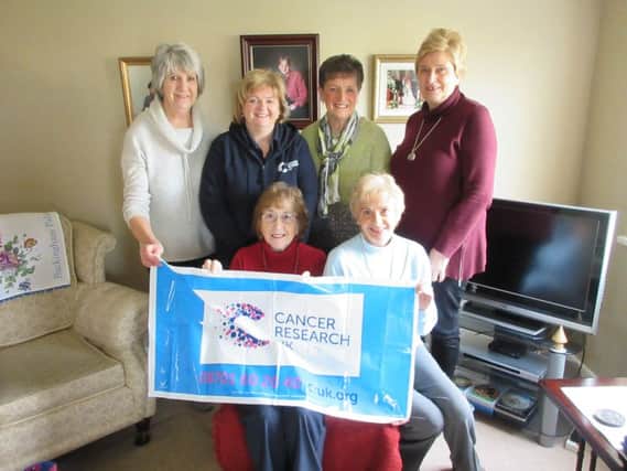 Committee members pictured at the launch of the Portstewart Cancer Research UK Christmas Card delivery service.