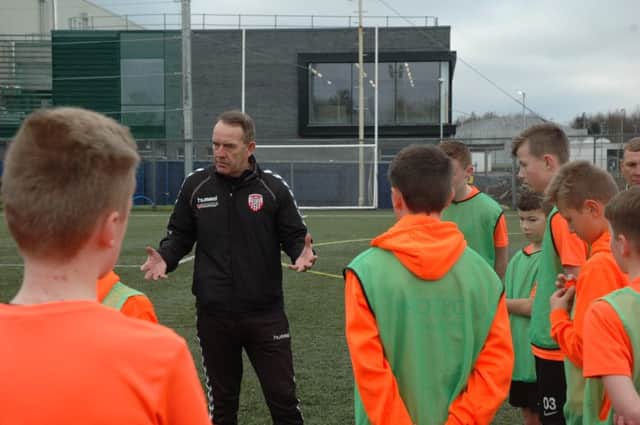 Kenny talks to the young players.