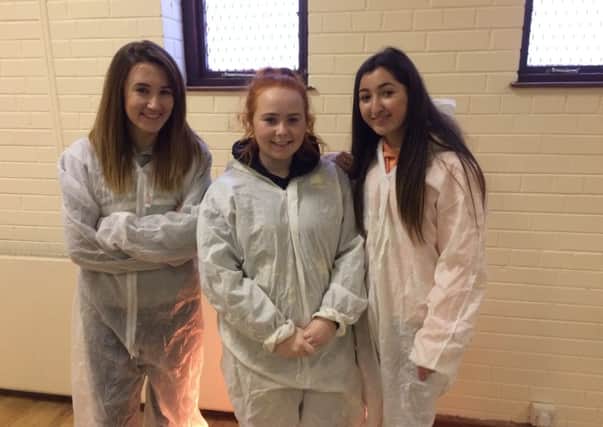 Ulidia sixth formers Shannon, Rebecca and Arianna were among the volunteers working on the Habitat project at St Michael's Parish Hall.