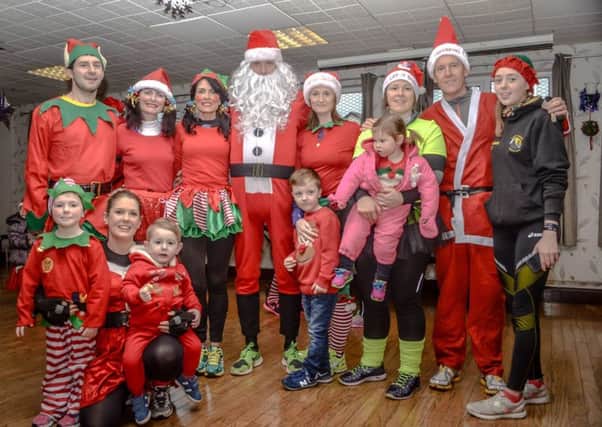 Santas and elves who took part in a previous Poppy's Santa Run for stillbirth charity SANDs. INLT-50-700-con