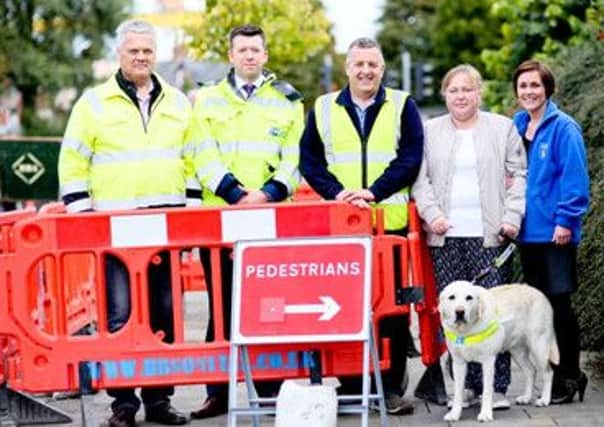 Neil Mees from Antrim with Ruadhrai OKane and Ballymena man John Burrows from NIE Networks with Vicky Kyle, Ivy the dog and Ursula McCanny from Guide Dogs NI at the launch of the training initiative.