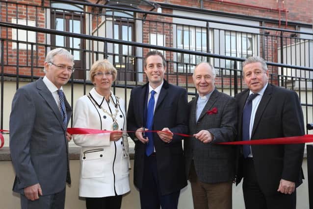 Communities Minister Paul Givan (centre) formally re-opens the hostel, included, from left, are Gerry Kelly, CEO, Apex Housing, Alderman Hilary McClintock, Mayor of Derry City and Strabane District Council,  Rev Peter Murray, chair, and Liam Milligan, Mission director,  North West Methodist Mission. INLS 50-701-CON