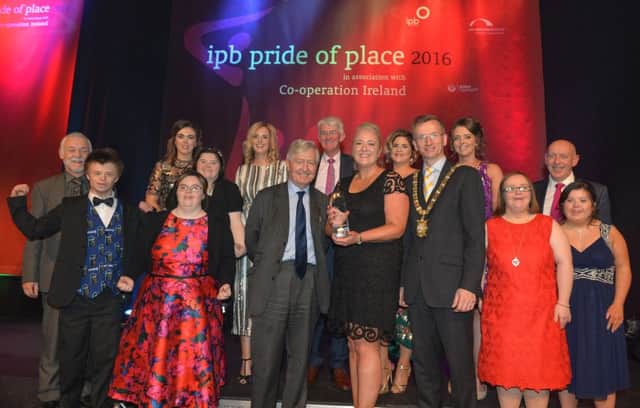 At the Pride of Place Awards ceremony are representatives from Foyle Down Syndrome Trust with the Lord Mayor of Belfast Alderman Brian Kingston, Dr Christopher Moran, chairman Co-operation Ireland, Tom Dowling, chairman of the Pride of Place Committee and Peter Sheridan, CEO of Co-operation Ireland. INLS 50-703-CON