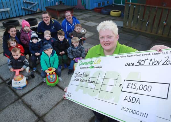 Pictured: Marta Moreria (Childcare assistant), Noeleen Simpson (Deputy Project Manager) and Lyn Patton (Childcare Assistant) with Asda Portadown Community Champion, Elaine Livingstone and children from Zero 8 Teen. INPT49