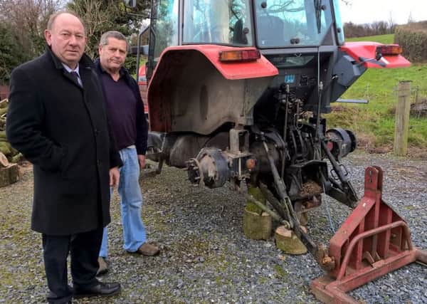 William Irwin MLA and  Brian McMahon with the Massey Ferguson tractor - minus its wheels and linkage. INPT49-011