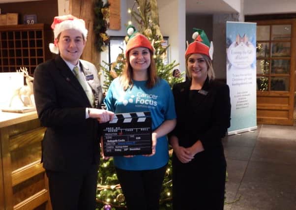 Ballygally Hotel Staff and Lianne Wilson from Cancer Focus NI get into the festive spirit for the Elf Screening