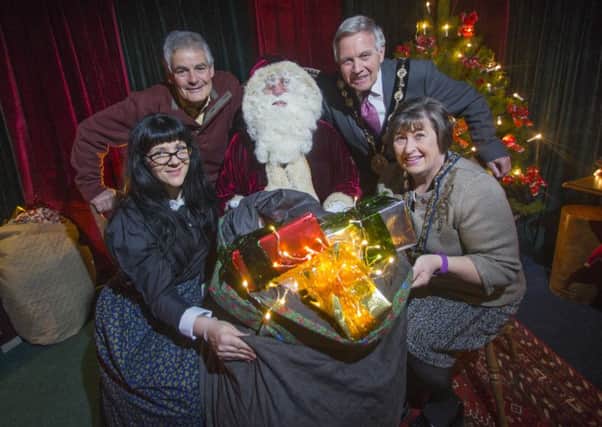 Pictured at the launch of Santa's Grotto in the Irish Linen Centre and Lisburn Museum to raise money for TinyLife are Emma Breaden; Councillor Tim Morrow, Chairman of the council's Lesiure & Community Development Committee; Santa Claus; Mayor Brian Bloomfield MBE and Mayoress Mrs Rosalind Bloomfield.