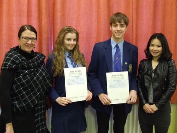 Students Carmen Owens and Cain McKendry from Loreto College Coleraine who successfully gained Beginner Level Mandarin Certificates as part of the Confucius Classroom initiative, with their Mandarin teacher and Mrs S Mullan of Loreto College.