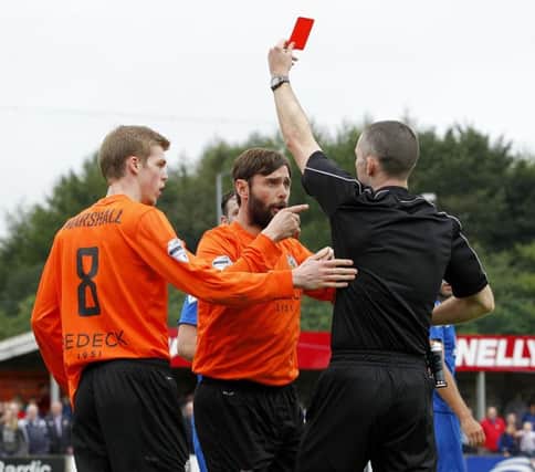 Gary Hamilton gets sent off by referee M Smyth during todays game at Stangmore Park, Dungannon.

Photo Alan Weir/Pacemaker Press
