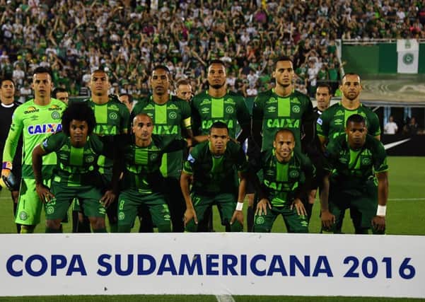 Brazil's Chapecoense players pose for pictures during their 2016 Copa Sudamericana semifinal second leg football match against Argentina's San Lorenzo held at Arena Conda stadium, in Chapeco, Brazil, on November 23, 2016.