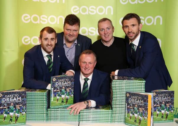 At the Dare to Dream book signing were (front, from left) Niall McGinn, Michael ONeill and Gareth McAuley along with (back, from left) co-author Nigel Tilson and photographer William Cherry, whose pictures are featured in Dare To Dream.Picture by Darren Kidd / Press Eye.