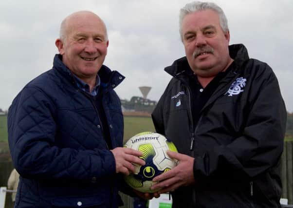 Mark Hutchinson (right) presents Mervyn Groves with a matchball sponsorship on behalf of Tom Kelly's Bar for Rathfriland Rangers' game against Ards Rangers.