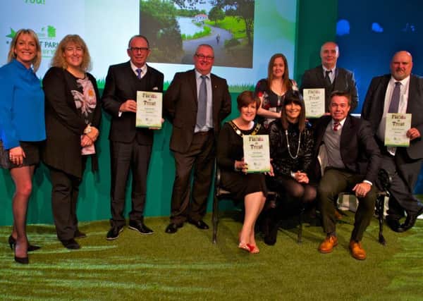 Representatives from each of the shortlisted parks receiving Awards from former international footballer and trustee of Fields in Trust Graeme Le Saux and TV sports presenter Jill Douglas.