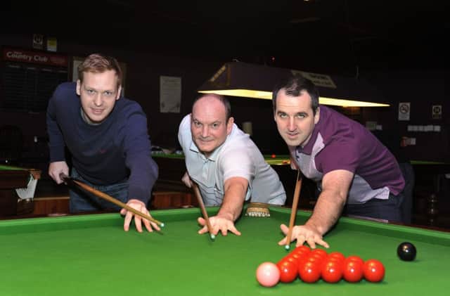 Tracey's Bar 'A' lost ground in the North-West Premier League title race, the aftermath of a 3-3 stalemate at Du Pont. From left Shay Norris, Paul Keenan and Anthony McGill. DER4816GS023