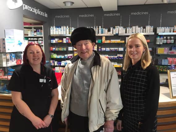From left; Emma Templeton with customer Mr Patrick Smyth and pharmacist Kerry Ross from The Health Centre Pharmacy, Carrickfergus supporting Age NIs No one should have no one at Christmas appeal, which encourages people to look out for older family, friends and neighbours to make sure they are not feeling lonely, particularly during the colder, darker winter days.