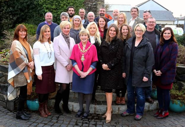 Local food producers who took part in the series of short films pictured with the 
Mayor of Causeway Coast and Glens Borough Council Maura Hickey, presenter 
Sarah Travers, representatives from Wolfhound Media and Louise McKinstrey from 
Tourism NI.