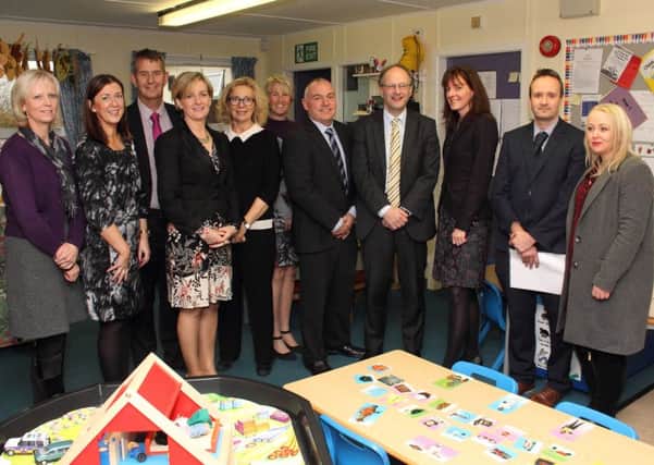 Dr Anne McKeever, SEHSCT; Lorraine Coulter, SEHSCT; Edwin Poots MLA; Mabel Scullion, Barnardos; Gail Malmo, PHA; Gillian Dunlop, Largymore Primary; Adrian Bird, Resurgam Trust; Peter Weir, Minister for Education; Tracey Cassells, Barbour Nursery School; Sean Campbell, Old Warren Primary and Amanda Lloyd, Lisburn Sure Start.