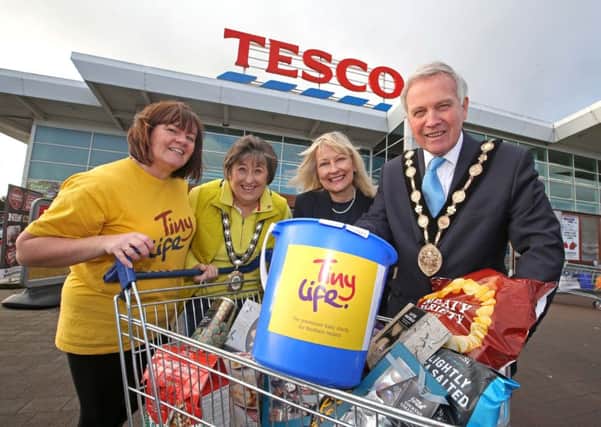 Pictured with the Mayor, Cllr Brian Bloomfield MBE and Mayoress, Mrs Rosalind Bloomfield are Valerie Cromie, TinyLife and Anne Broome, Community Champion, Tesco Lisburn.