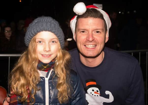 Poetry Competition winner Jane McCarroll (Moira Primary School) pictured with Simon Henry (Church of Ireland Youth Officer) after switching on the Christmas tree lights in Moira on Wednesday 30th November.  (Photo by Joy Wells).