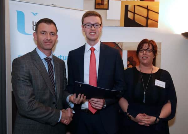Aaron Callaghan (centre) is presented with the PwC award by PwC Partner Ian McConnell and Course Director Danielle McWall.